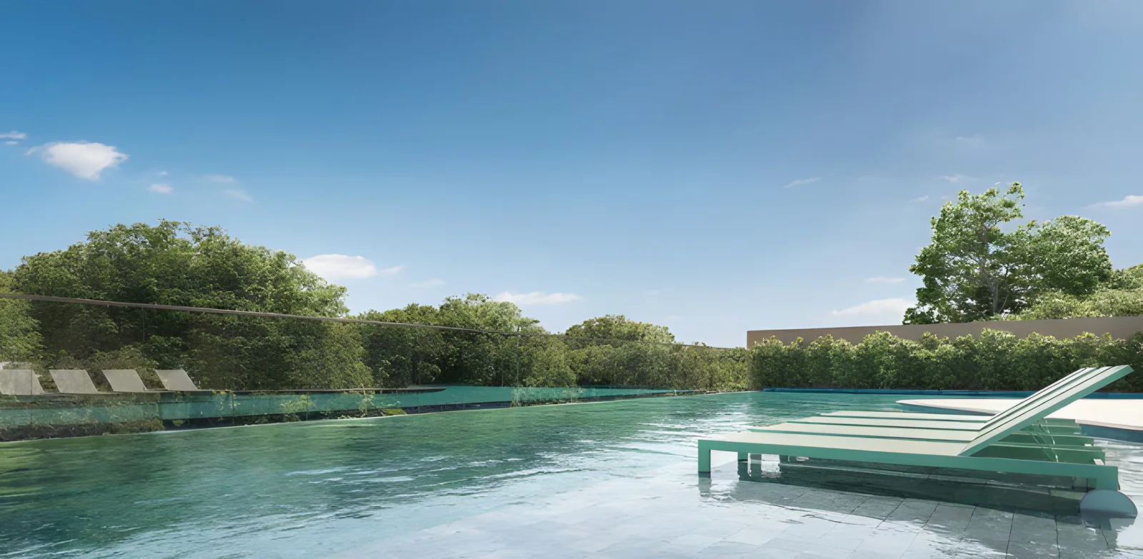 Piscina de borda infinita com espreguiçadeiras dentro da água e a mata do parque ao fundo